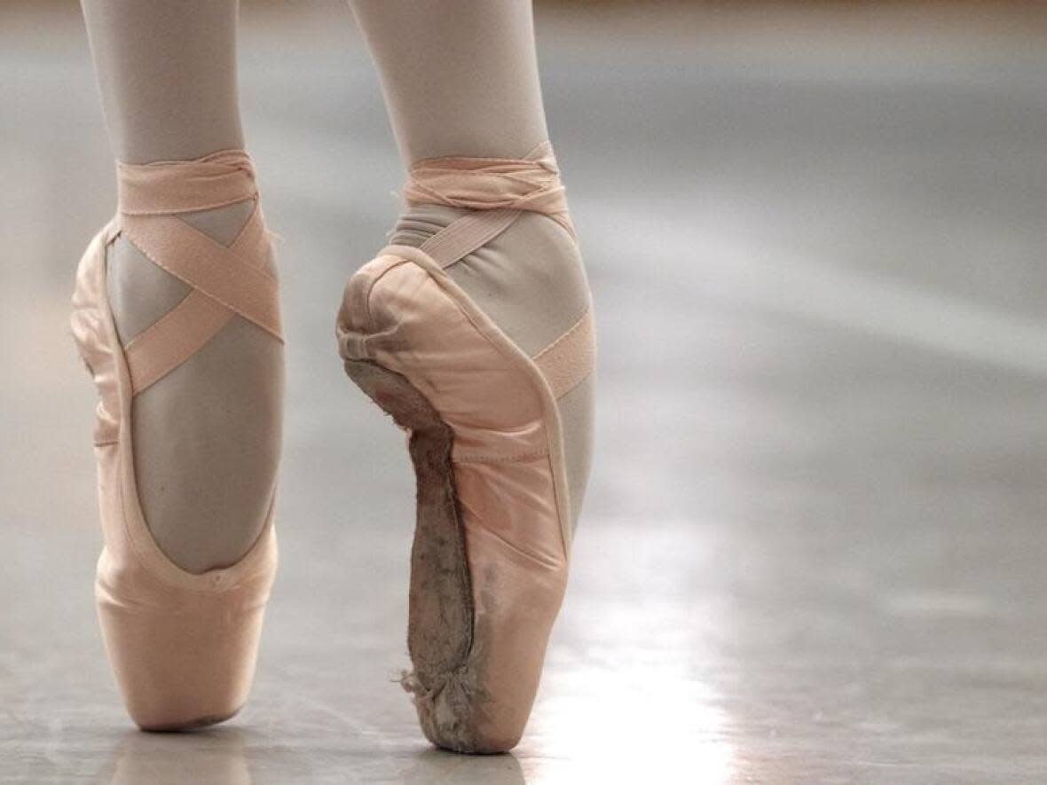 The Royal Winnipeg Ballet has agreed to a $10-million class-action settlement with students who say they were photographed nude or in sexualized ways by former RWB photographer and instructor Bruce Monk. (Matt Rourke/The Associated Press - image credit)