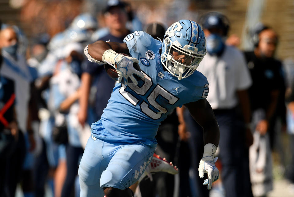 Javonte Williams was a freight train against North Carolina State on Saturday. (Photo by Grant Halverson/Getty Images)