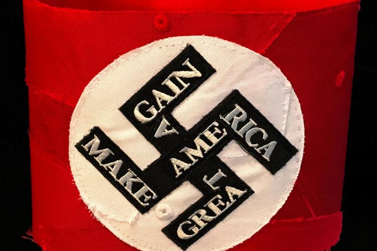 As Facebook cracks down on white nationalist content, a left-wing artist was caught in the crosshairs after the network said her MAGA hat-inspired artwork violated community guidelines.Kate Kretz, a Maryland-based artist, refashions Donald Trump’s infamous “Make America Great Again” hats into traditional symbols of white supremacy and hatred, such as the Ku Klux Klan hood and a swastika armband. Ms Kretz does not create this art because she believes in white supremacy, but rather “to both call out wearers who claim the hats to be innocuous, and to sound the alarm that history is repeating itself,” she wrote in a blog post.After Ms Kretz’s MAGA swastika armband was taken down by Facebook, she appealed the removal decision and reposted the image with the caption: “This is not hate speech. This is an art piece addressing hate speech.”Facebook didn’t respond to Ms Kretz’s appeal in a timely manner, but did respond to the republication of her art by freezing her Facebook account, leaving her unable to post or interact with her followers. As an artist, Ms Kretz uses social media as a platform to maintain her livelihood, and to be booted from the platform can be detrimental. Ms Kretz’s ban comes after Facebook’s recently adopted policies on white nationalism as the company was criticised for being historically lax on white supremacist content.“I understand doing things for the greater good,” Ms Kretz told local news station WUSA-TV. “However, I think artists are a big part of Facebook’s content providers, and they owe us a fair hearing.” A petition to restore Ms Kretz’s Facebook account is available to sign. “It is important for artists who we agree or disagree with to be able to show their work,” the petition notes. For now, Ms Kretz’s artwork is accessible on her website.