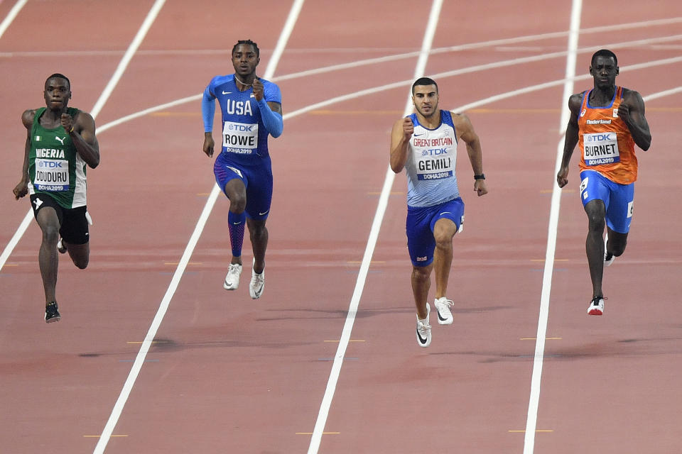 Divine Oduduro, of Nigeria, Rodney Rowe, of the United States, Adam Gemili, of Great Britain, and Taymir Burnet, of the Netherlands,, from left to right, compete in the men's 200 meter heats during the World Athletics Championships in Doha, Qatar, Sunday, Sept. 29, 2019. (AP Photo/Martin Meissner)