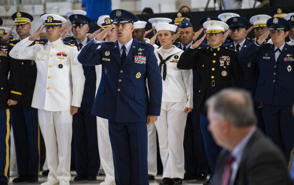 U.S. Space Command Chief of Staff, Brig. Gen. Brook Leonard, and the rest of his staff give their first salute to Commander Gen. John W. Raymond Monday, Sept. 9, 2019, during a ceremony to recognize the establishment of the United States Space Command at Peterson Air Force Base in Colorado Springs, Colo. (Christian Murdock/The Gazette via AP)