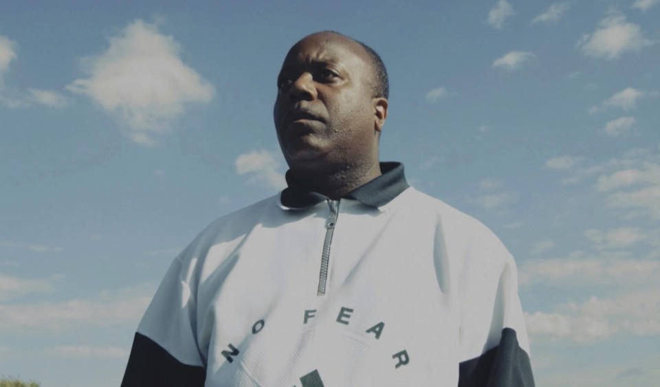 This grab taken from video taken on Aug. 21, 2015, shows Jermaine Wright, a NHS pharmacist and referee of the Hackney Marshes grassroots football league, in London. Wright, affectionately known as Mr. Hackney Marshes, served as both an on-field referee and a behind-the-scenes catalyst in the Hackney & Leyton Sunday Football League — as vice chairman, schedule secretary, results secretary, press officer, and head official before he died on April 27, 2020 from COVID-19. (Thomas Wootton via AP)