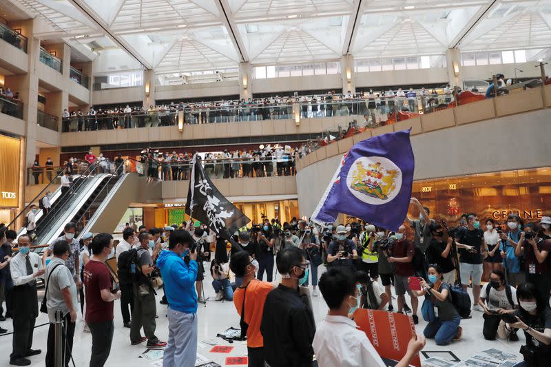 Pro-democracy demonstrators stage a rally at a shopping mall in Hong Kong