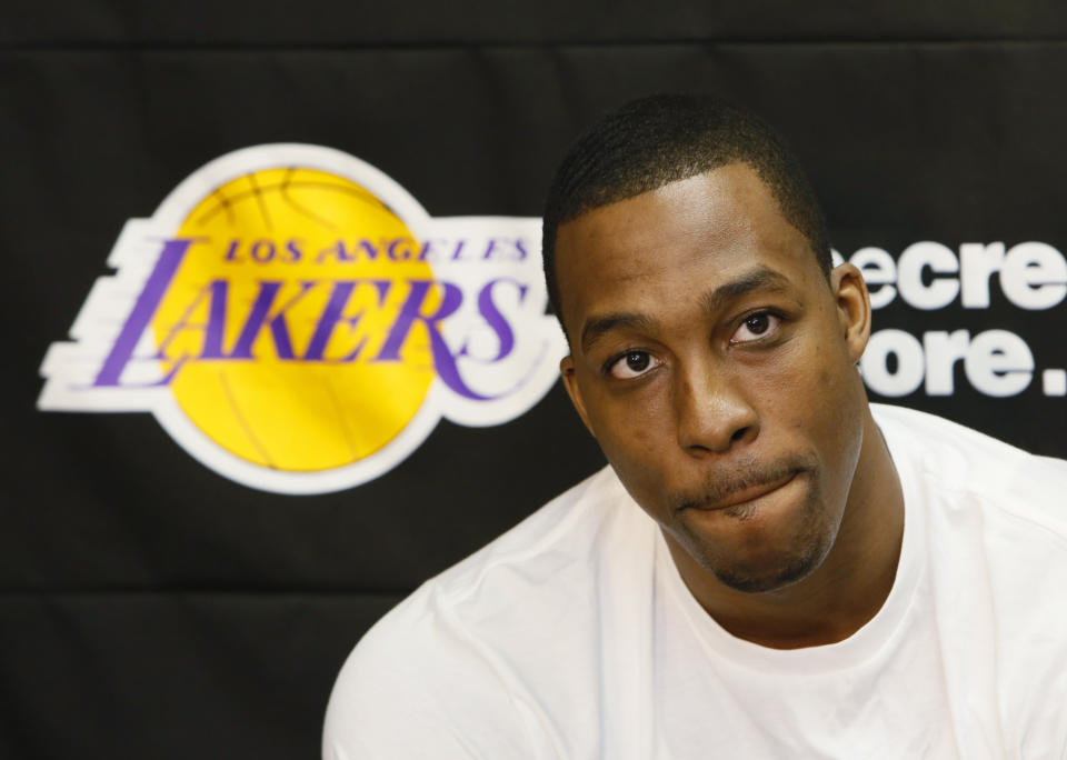 Los Angeles Lakers center Dwight Howard talks to reporters in El Segundo, Calif., Tuesday, April 30, 2013. The Lakes lost their first-round NBA basketball playoff series to the San Antonio Spurs. (AP Photo/Damian Dovarganes)