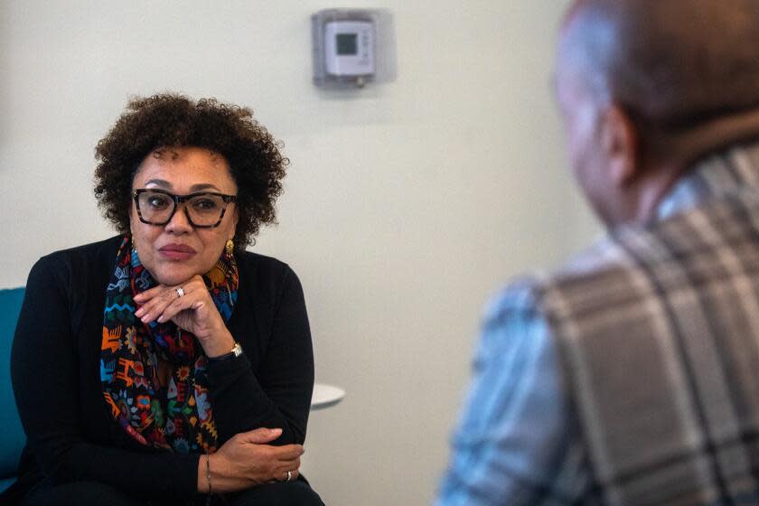 Los Angeles, CA - April 24: Maria Rosario Jackson, left, listens to TONY BROWN Heart of Los Angeles Youth (HOLA) CHIEF EXECUTIVE OFFICER as Maria tours HOLA on Monday, April 24, 2023, in Los Angeles, CA. Maria Rosario Jackson an LA native, was appointed by President Biden as the Chair of the National Endowment for the Arts. (Francine Orr / Los Angeles Times)