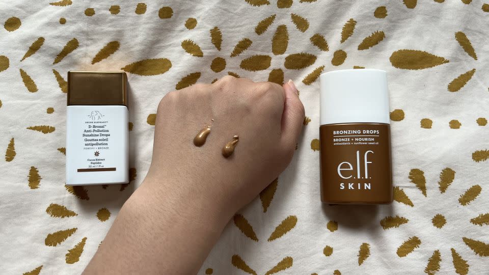Drunk Elephant D-Bronzi Bronzing Drops on swatched on the left. E.l.f. Cosmetics Bronzing Drops in Pure Gold swatched on the right. - Sophie Shaw/CNN Underscored