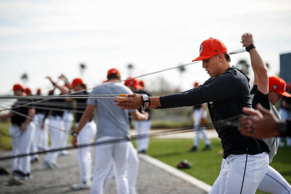 Detroit Tigers pitcher Wilmer Flores stretches during spring training at Tigertown in Lakeland, Fla. on Tuesday, Feb. 13, 2024.