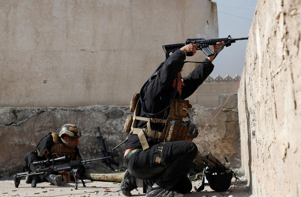 <p>An Iraqi special forces soldier fires his rifle at Islamic State fighters’ positions during a battle in Mosul, Iraq Feb. 28, 2017. (Goran Tomasevic/Reuters) </p>