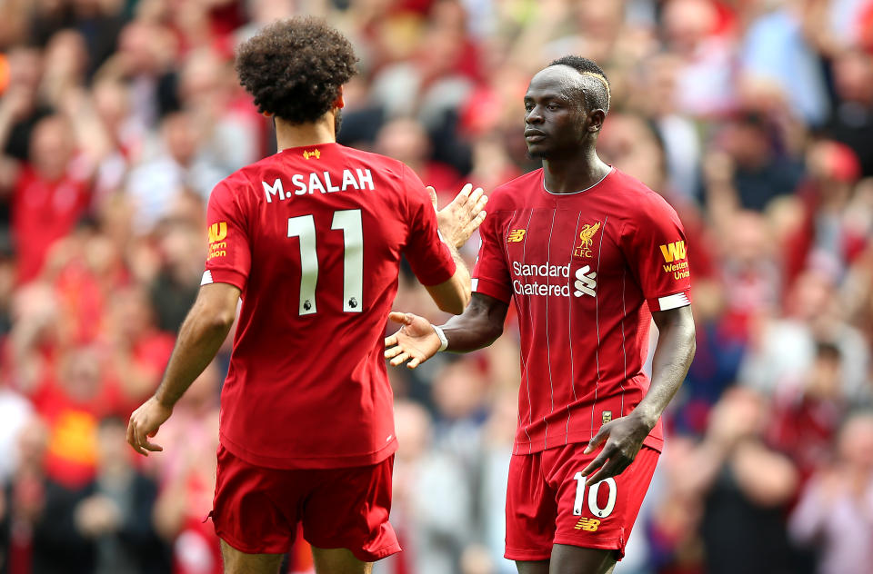 Liverpool's Sadio Mane (right) celebrates scoring his side's second goal of the game with team-mate Mohamed Salah during the Premier League match at Anfield, Liverpool. (Photo by Nigel French/PA Images via Getty Images)