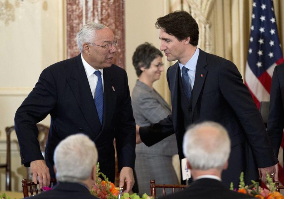 Canadian Prime Minister Justin Trudeau greets former Secretary of State Colin Powell during a luncheon meeting at the State Department in Washington, Thursday, March 10, 2016. (AP Photo/Manuel Balce Ceneta)