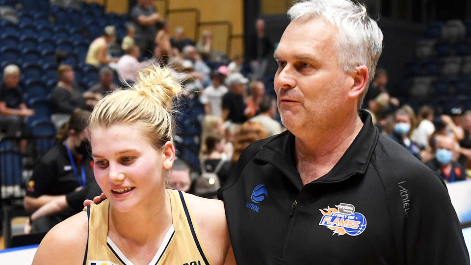 Shyla and Shane Heal are pictured together after a WNBL game.