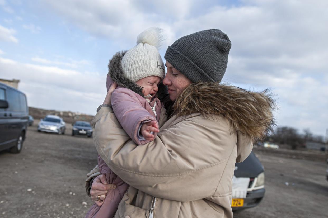 <span class="caption">A Ukrainian woman who fled the war is pictured with her son after they crossed into Moldova on March 18, 2022.</span> <span class="attribution"><a class="link " href="https://media.gettyimages.com/photos/ukrainian-woman-who-fled-the-war-with-her-son-after-crossing-the-picture-id1239316855?s=2048x2048" rel="nofollow noopener" target="_blank" data-ylk="slk:Andrea Mancini/NurPhoto via Getty Images;elm:context_link;itc:0;sec:content-canvas"> Andrea Mancini/NurPhoto via Getty Images</a></span>