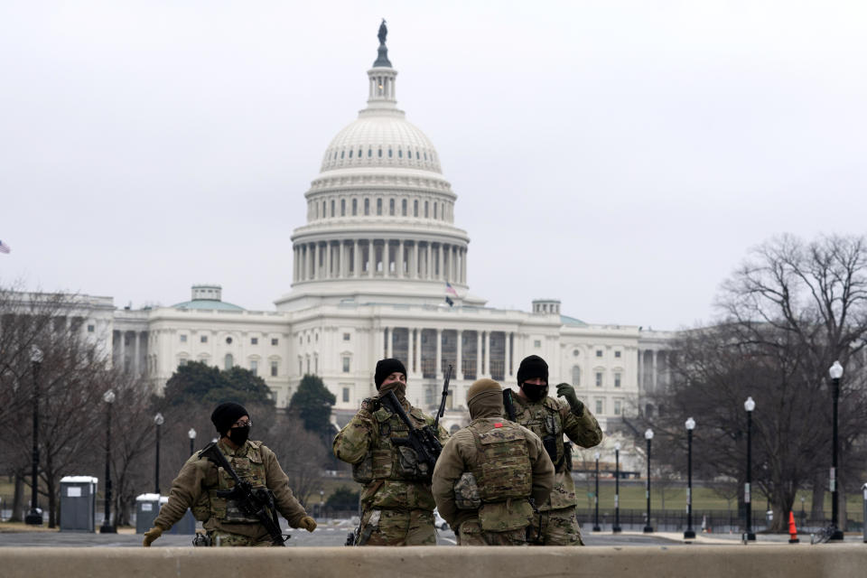 Members of the National Guard patrol the area outside of the U.S. Capitol on the third day of the second impeachment trial of former President Donald Trump, on Capitol Hill in Washington, Thursday, Feb. 11, 2021. (AP Photo/Jose Luis Magana)