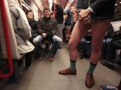 A passenger, not wearing pants, stands in a subway train during the "No Pants Subway Ride" in Prague January 12, 2014. The event is an annual flash mob and occurs in different cities around the world in January, according to its organisers. REUTERS/David W Cerny (CZECH REPUBLIC - Tags: TRANSPORT SOCIETY ANNIVERSARY TPX IMAGES OF THE DAY)