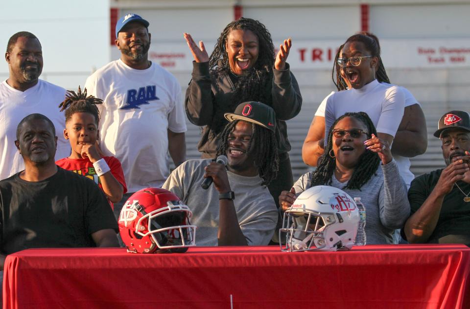 Vero Beach High School linebacker T.J. Alford announces his commitment to play football for Ohio State while sitting with his family inside the school's Citrus Bowl stadium on Saturday, March 30, 2024, in Vero Beach.