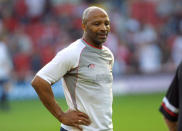 FILE PHOTO: Cyrille Regis takes part in a Southampton v All Star XI benefit match for Danny Wallaceat St Mary's Stadium in Southampton, Britain, May 17, 2004. -REUTERS/Paul Childs/File Photo