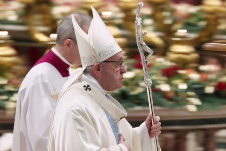 Pope Francis leaves after leading a mass to mark the World Day of Peace in Saint Peter's Basilica at the Vatican, January 1, 2019. REUTERS/Tony Gentile