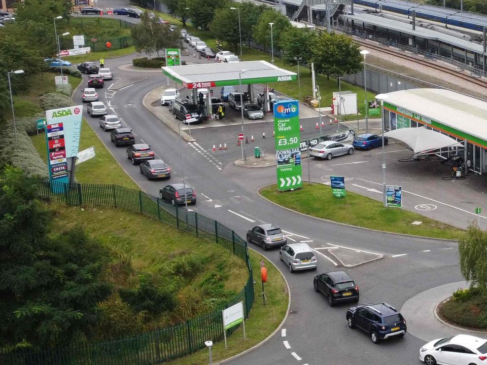 An aerial view shows customers queueing in their cars to access an Asda petrol station in east London (AFP via Getty Images)