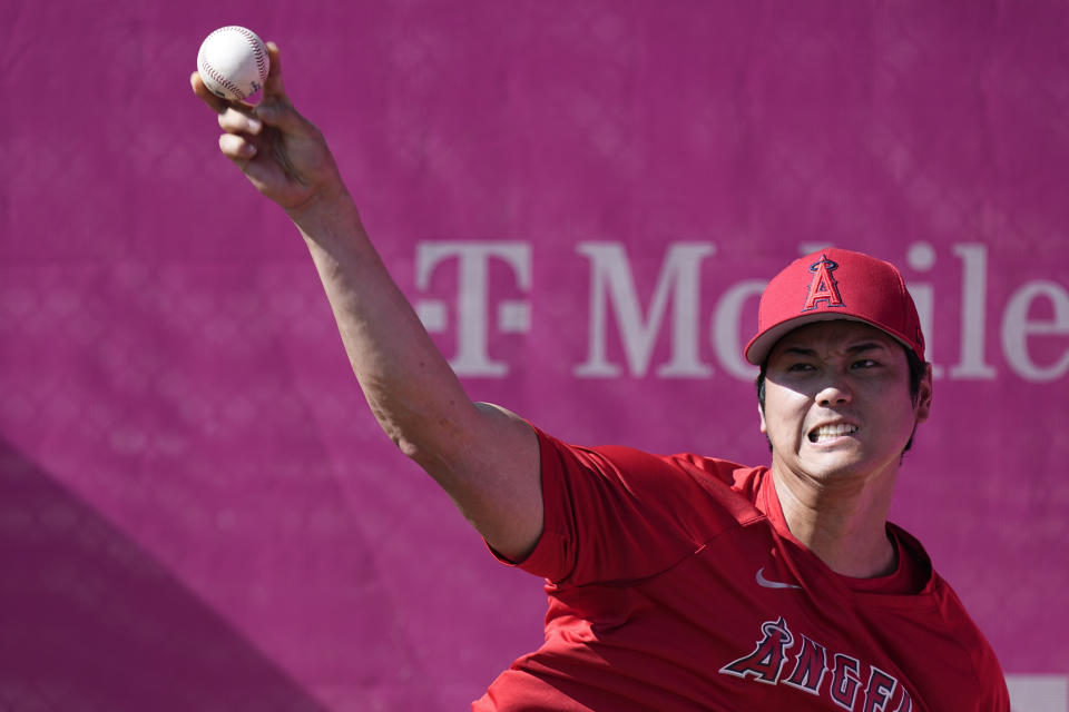 Los Angeles Angels starting pitcher Shohei Ohtani (17) warms up before a baseball game against the Atlanta Braves Tuesday, Aug. 1, 2023, in Atlanta. (AP Photo/John Bazemore)