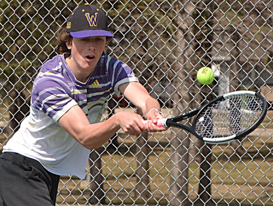 Watertown's Justin Remmers focuses on hitting the ball during a high school boys tennis dual against Milbank on Tuesday, April 9, 2024 at the Highland Park courts in Watertown.