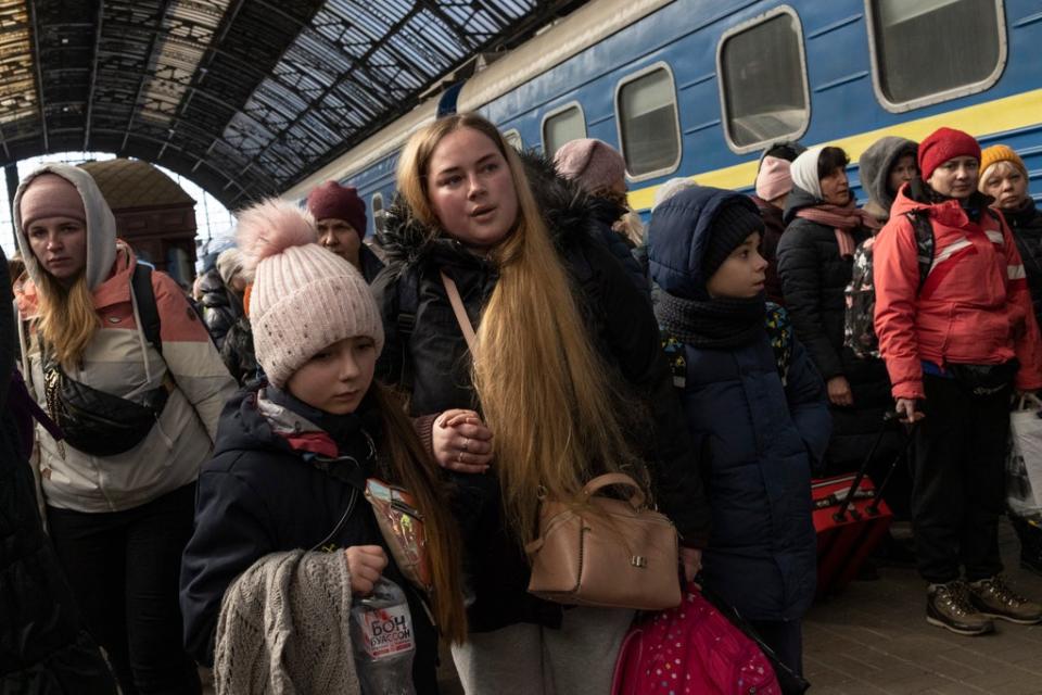 Passengers depart the railway station after disembarking trains from the east on March 11, 2022 in Lviv, Ukraine (Getty Images)
