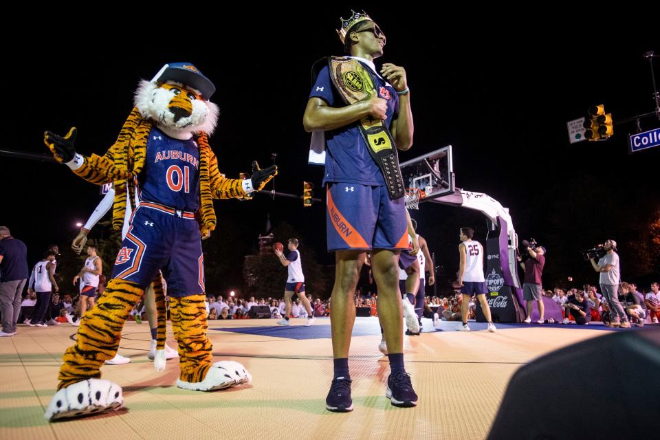 Auburn's Dylan Cardwell pumps up the crowd during Tipoff at Toomer's in downtown Auburn, Ala., on Thursday, Oct. 7, 2021. 