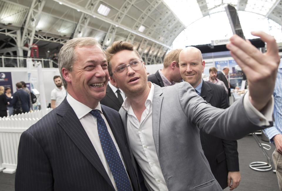 United Kingdom Independence Party leader Nigel Farage poses for a "selfie" photograph after delivering a speech at the Master Investor show in north London