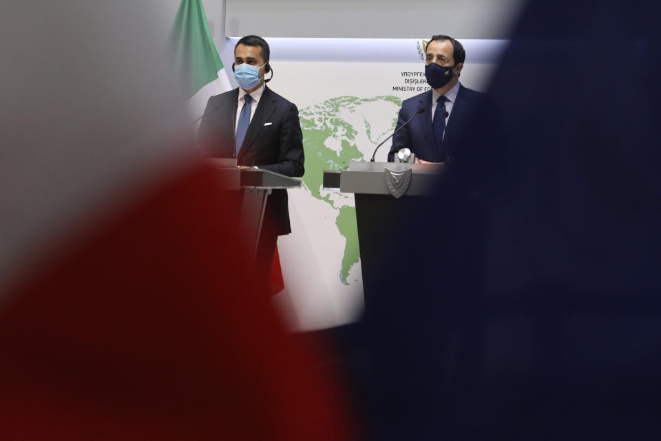 Cypriot Foreign Minister Nicos Christodoulides, right, and Italian Foreign Minister Luigi Di Maio take part in a press conference after their meeting at the Foreign Ministry house in Nicosia, Cyprus, Tuesday, March 9, 2021. Maio is in Cyprus on a one-day visit. (Yiannis Kourtoglou Pool via AP)