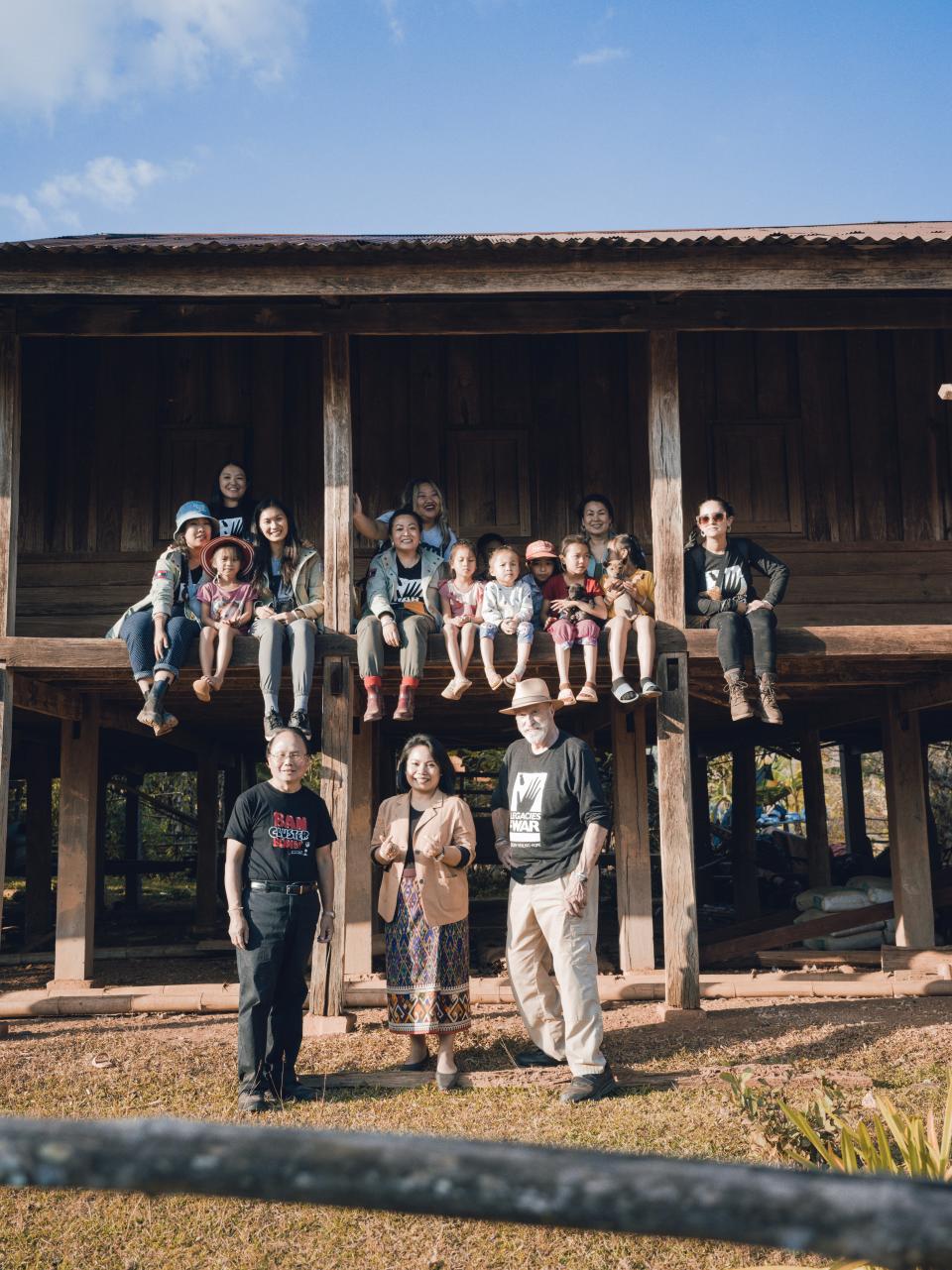 The Legacies of War team visits a village house in northern Laos on Nov. 8, 2022. From 1964-73, the United States dropped more than 2.5 million tons of bombs on Laos during 580,000 missions. A third of the bombs did not explode, leaving millions buried today.