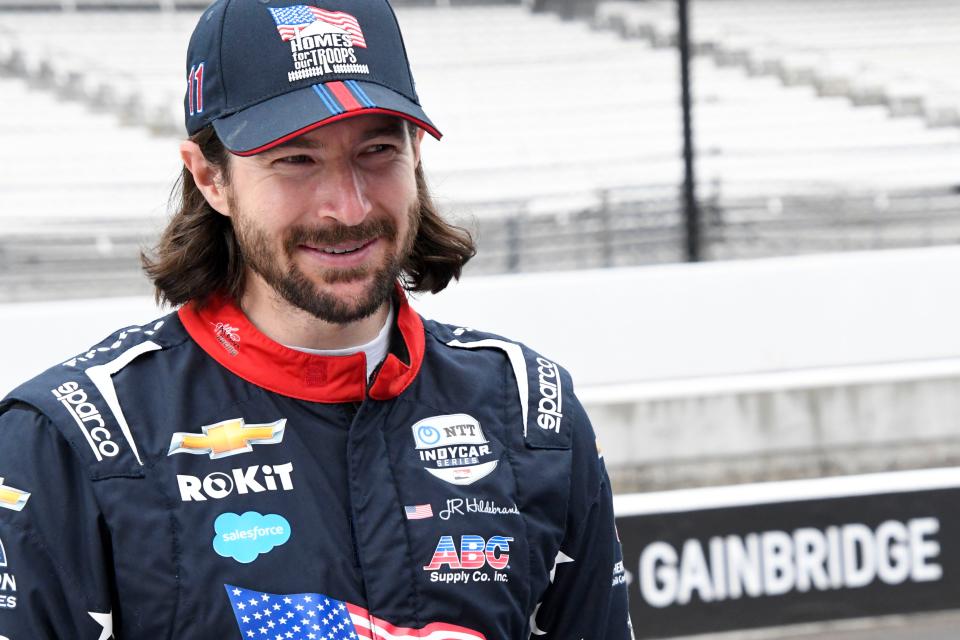 A. J. Foyt Enterprises driver JR Hildebrand (11) stands near his pit box Saturday, May 21, 2022, during practice before the first day of qualifying for the 106th running of the Indianapolis 500 at Indianapolis Motor Speedway