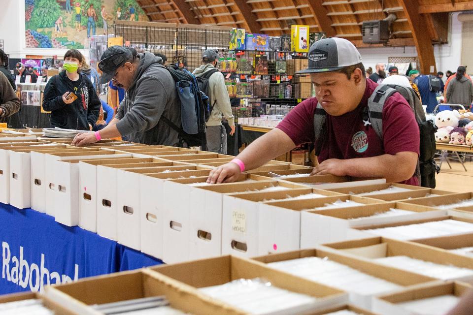 Eric Acosta from Stockton is going box by box to find his favorite comic book, Spiderman at the Lodi Comic Con at Lodi Grape Festival on May 8th. Dianne Rose/For The Record