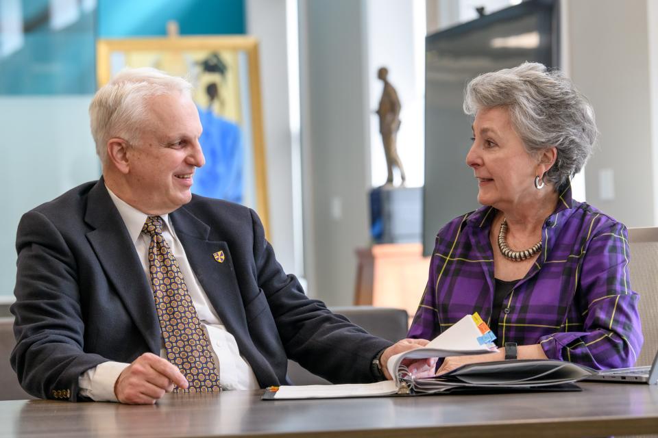 Albion College Interim President Joe Calvaruso talks in 2022 with Board of Trustees Chairwoman Joey Miller.