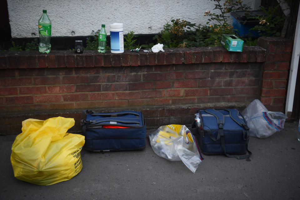 Forensic bags at the scene in Raymead Avenue, Thornton Heath, Croydon where a women who was around eight months pregnant has been stabbed to death and her baby is critically ill in hospital.