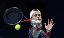 Diego Schwartzman of Argentina plays a return to Daniil Medvedev of Russia during their singles tennis match at the ATP World Finals tennis tournament at the O2 arena in London, Friday, Nov. 20, 2020. (AP Photo/Frank Augstein)