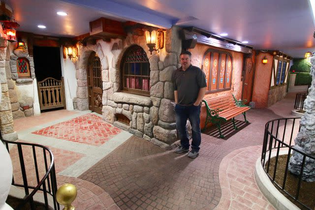 <p>courtesy of Travis Larson</p> Travis Larson and his Disney-style basement