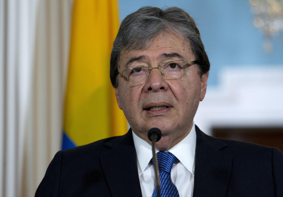 FILE - In this Oct. 9, 2019 file photo, Colombian Foreign Minister Carlos Holmes Trujillo speaks to reporters after a bilateral meeting at the Department of State in Washington. Colombian officials say Defense Minister Carlos Holmes Trujillo has died from complications of COVID-19. He was 69. President Ivan Duque said in a statement that Holmes Trujillo died early Tuesday, Jan. 26, 2021 adding that he “couldn’t express the pain” he was feeling over the news. (AP Photo/Jose Luis Magana, file)