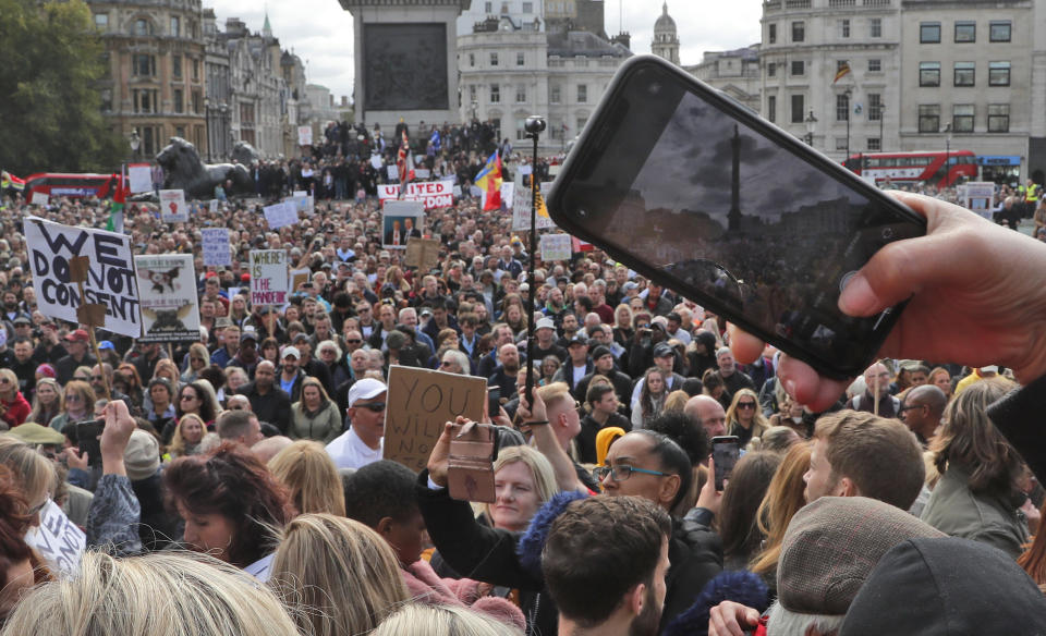 People take part in a 'We Do Not Consent' rally at Trafalgar Square, organised by Stop New Normal, to protest against coronavirus restrictions, in London, Saturday, Sept. 26, 2020. (AP Photo/Frank Augstein)