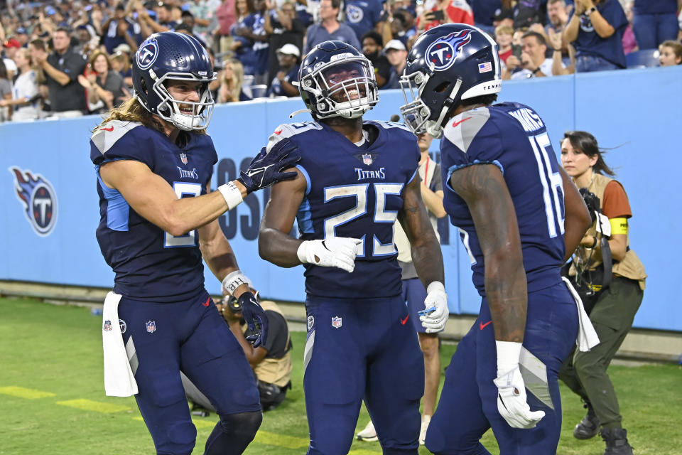 Tennessee Titans wide receiver Treylon Burks (16) celebrates with Cody Hollister, left, and Hassan Haskins (25) after Burks scored a touchdown against the Arizona Cardinals in the first half of a preseason NFL football game Saturday, Aug. 27, 2022, in Nashville, Tenn. (AP Photo/Mark Zaleski)