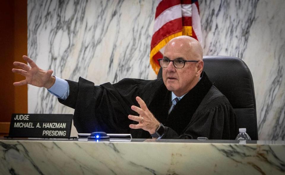 Judge Michael Hanzman gestures on May 11, 2022, as he speak to attorneys in court where a settlement has been reached for Surfside collapse victims.