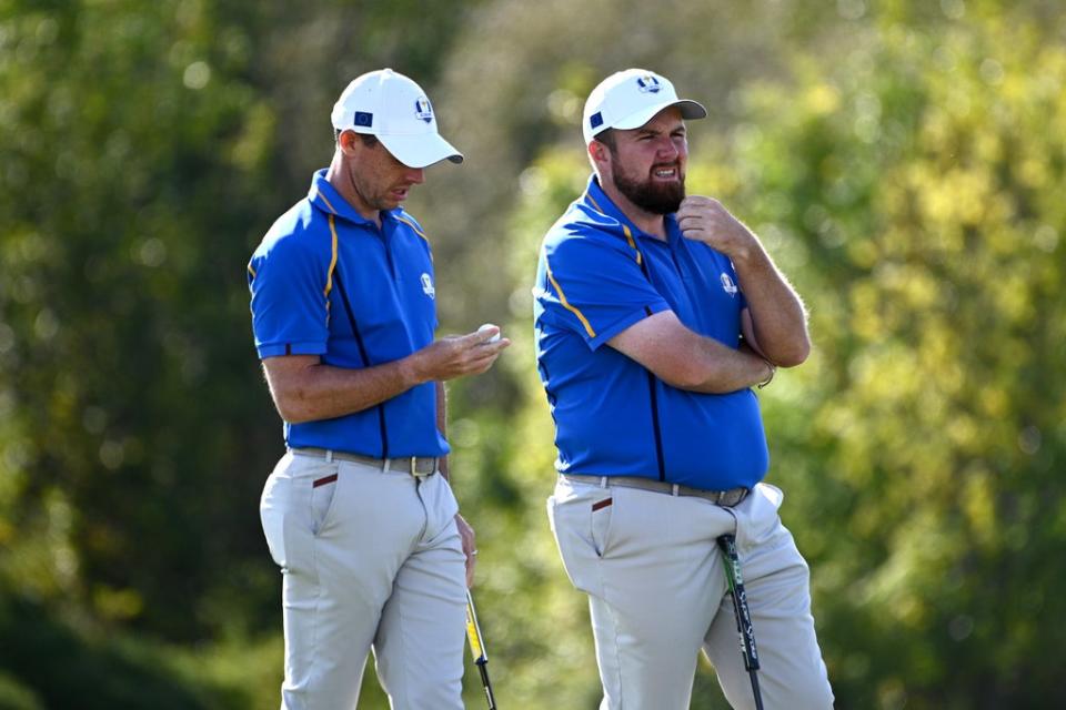 Rory McIlroy (left) and Shane Lowry on the 10th hole during day two of the Ryder Cup (Anthony Behar/PA) (PA Wire)