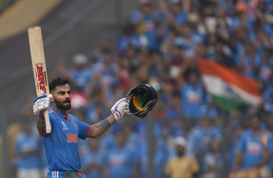 India's Virat Kohli celebrates his century during the ICC Men's Cricket World Cup first semifinal match between India and New Zealand in Mumbai, India, Wednesday, Nov. 15, 2023. (AP Photo/Rafiq Maqbool)