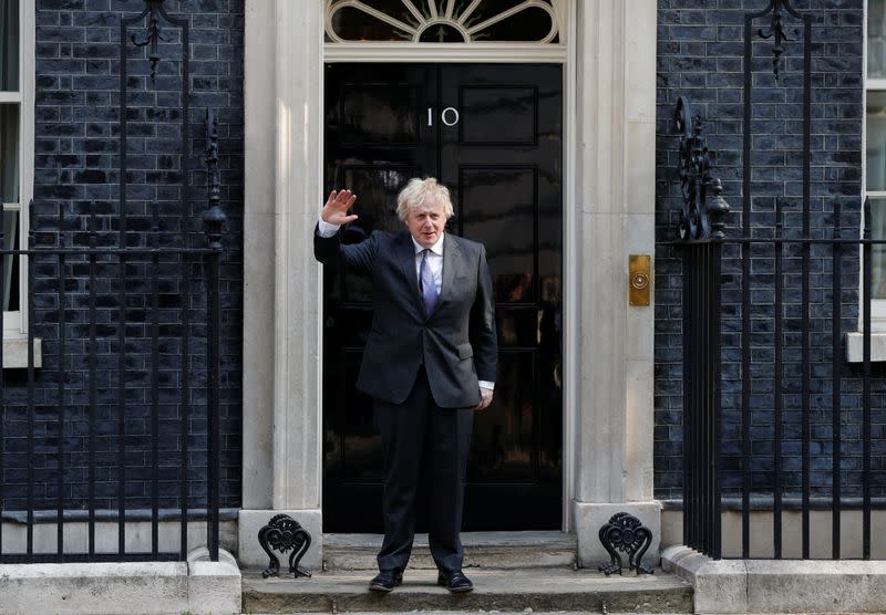 Britain's Prime Minister Boris Johnson waves as he leaves Downing Street in London