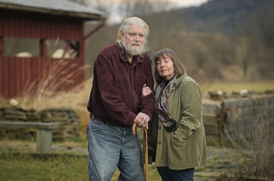 Joan and Harold Koster pose for a photo on their property, also known as Itaska Valley Farm, Wednesday, March 13, 2024, in Whitney Point, N.Y. The Kosters were asked by Texas-based Southern Tier Energy Solutions to lease their land to extract natural gas by injecting carbon dioxide into the ground, which they rejected and are opposed to. (AP Photo/Heather Ainsworth)
