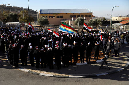 Druze Arabs on the Israeli-occupied Golan Heights hold an anti-election protest outside a municipal polling station in Majdal Shams, October 30, 2018 REUTERS/Ammar Awad