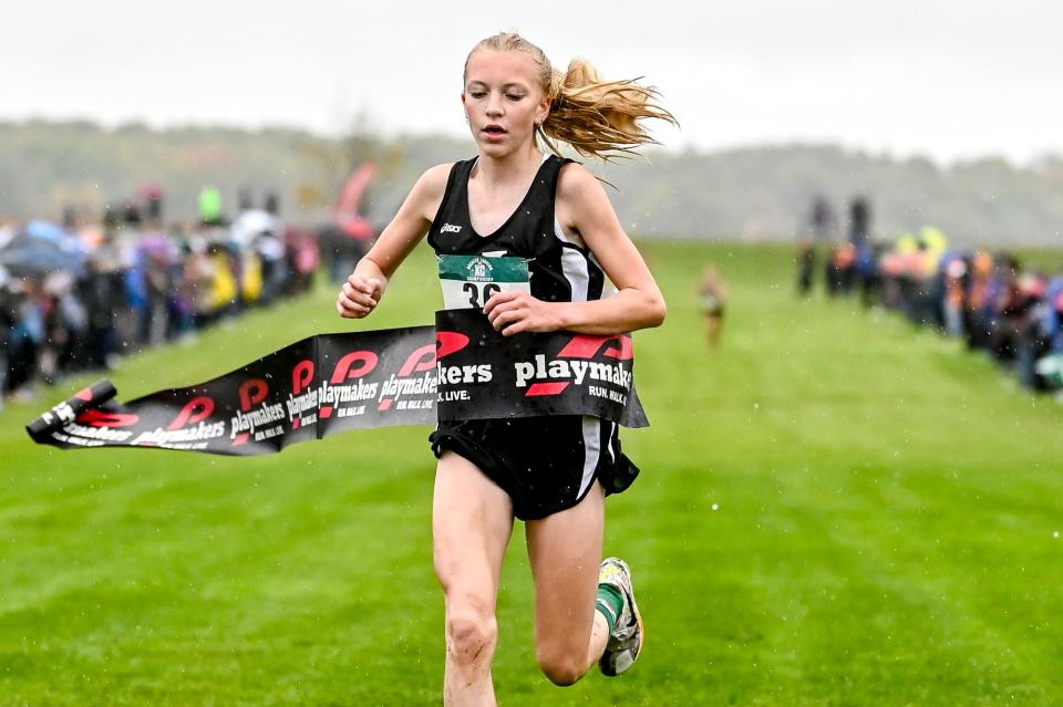 St. Johns Ava Schafer wins the girls Greater Lansing Cross Country Championships on Saturday, Oct. 14, 2023, at Ledge Meadows Golf Course in Grand Ledge.