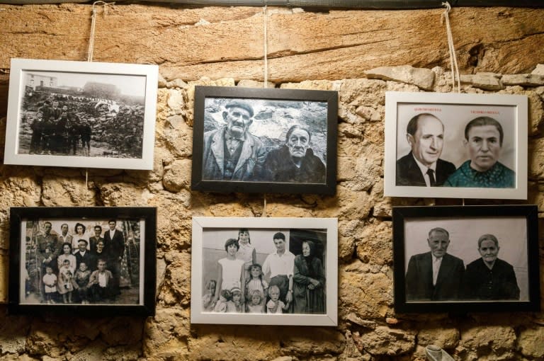 Former inhabitants' photos adorn the wall of the Friends of Sarnago association museum