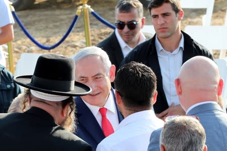 Israeli Prime Minister Benjamin Netanyahu attends a ceremony to unveil a sign for a new community named after U.S. President Donald Trump, in the Israeli-occupied Golan Heights