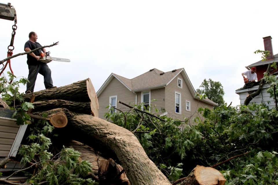 Citizens regroup after a severe storm caused numerous fallen trees and a loss of power for much of central Ohio in Newark, Ohio on Saturday, June 30, 2012. Zach Gray/The Advocate