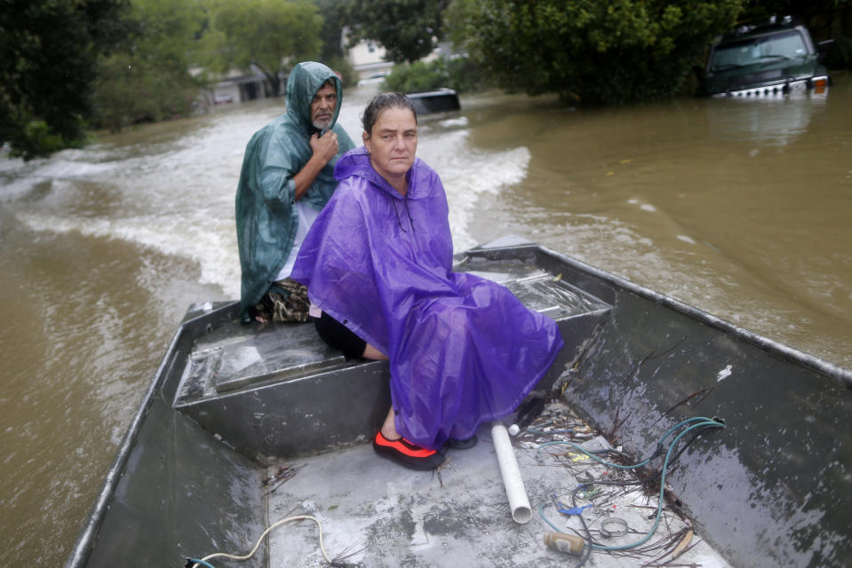 Curtis and Michelle Bertrand look for residents to rescue in Beaumont Place, Houston, on Monday. (Photo: Jonathan Bachman/Reuters)