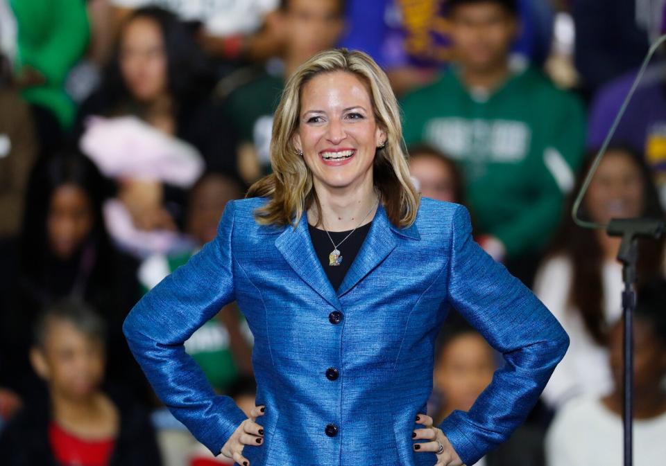 Jocelyn Benson, Democratic candidate for Secretary of State appears during a rally in Detroit. New Michigan Secretary of State Benson moved Thursday, Jan. 17, 2019, to settle a lawsuit that challenges the state's Republican-drawn legislative and congressional districts, a step that potentially could lead to new maps for the 2020 election.